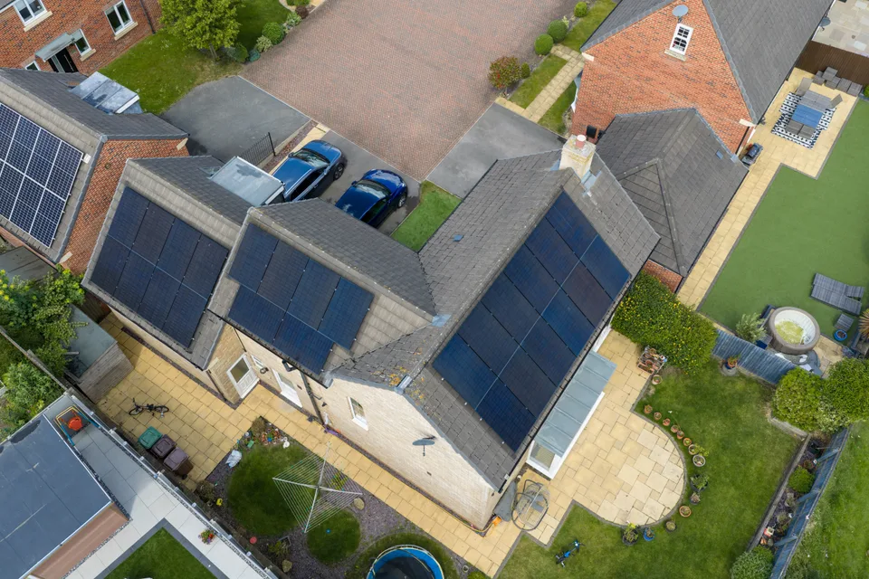 Solar panels on several roof faces of a detached home in Wakefield, Yorkshire.